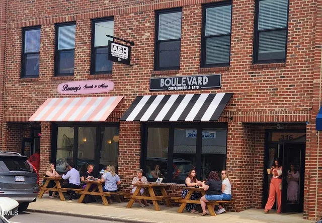 a view of a brick building with many windows