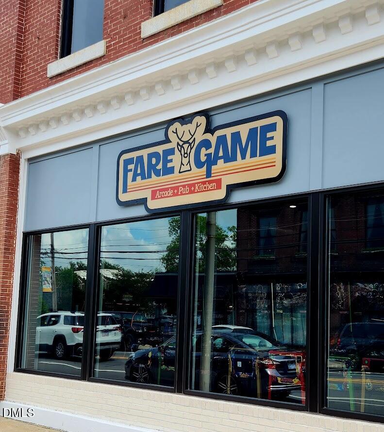 306 South Moore Street Clayton, NC 27520 - Photo 26 of 31 a view of street with retail shops