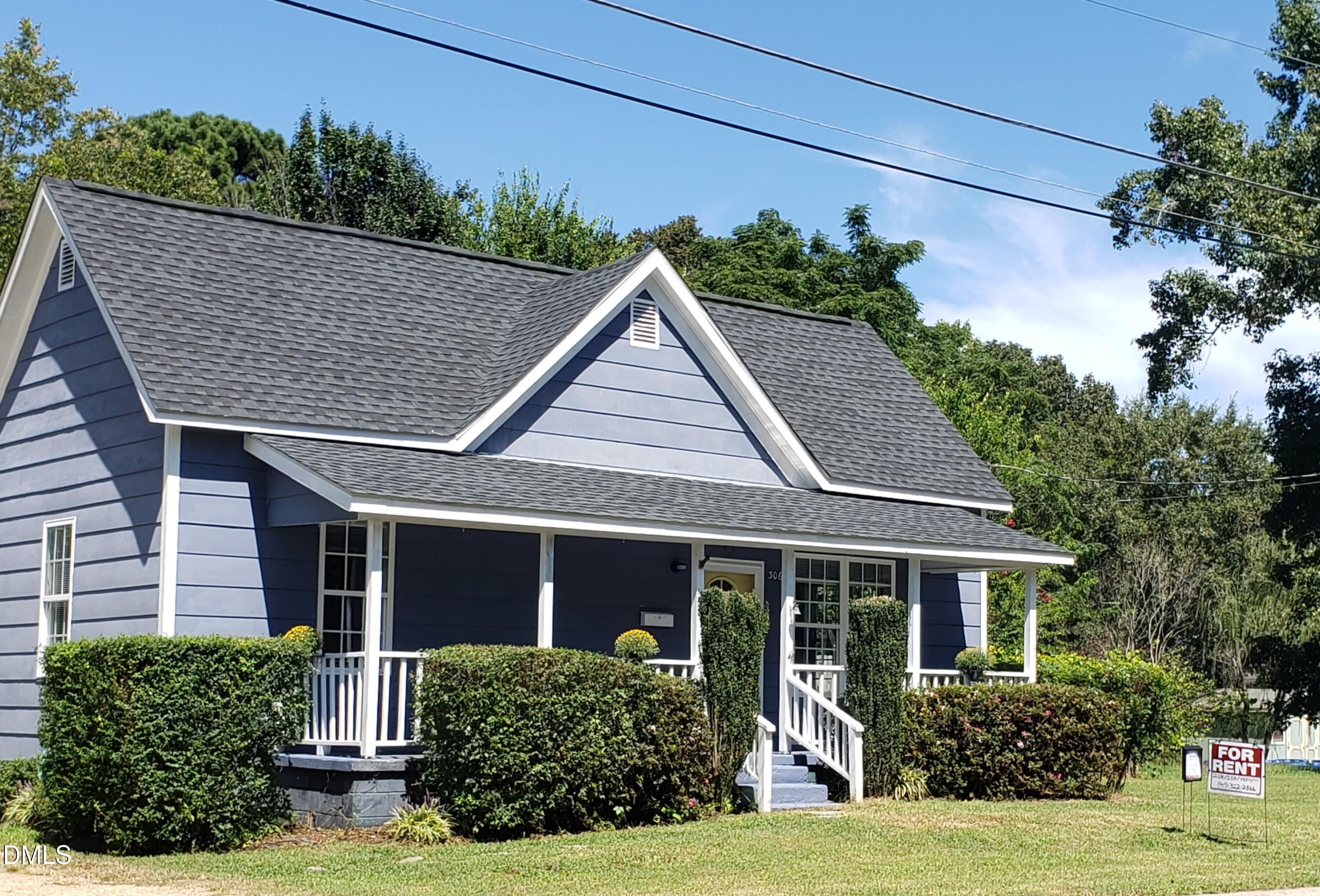 306 South Moore Street Clayton, NC 27520 - Photo 28 of 31 a view of a house with yard and plants