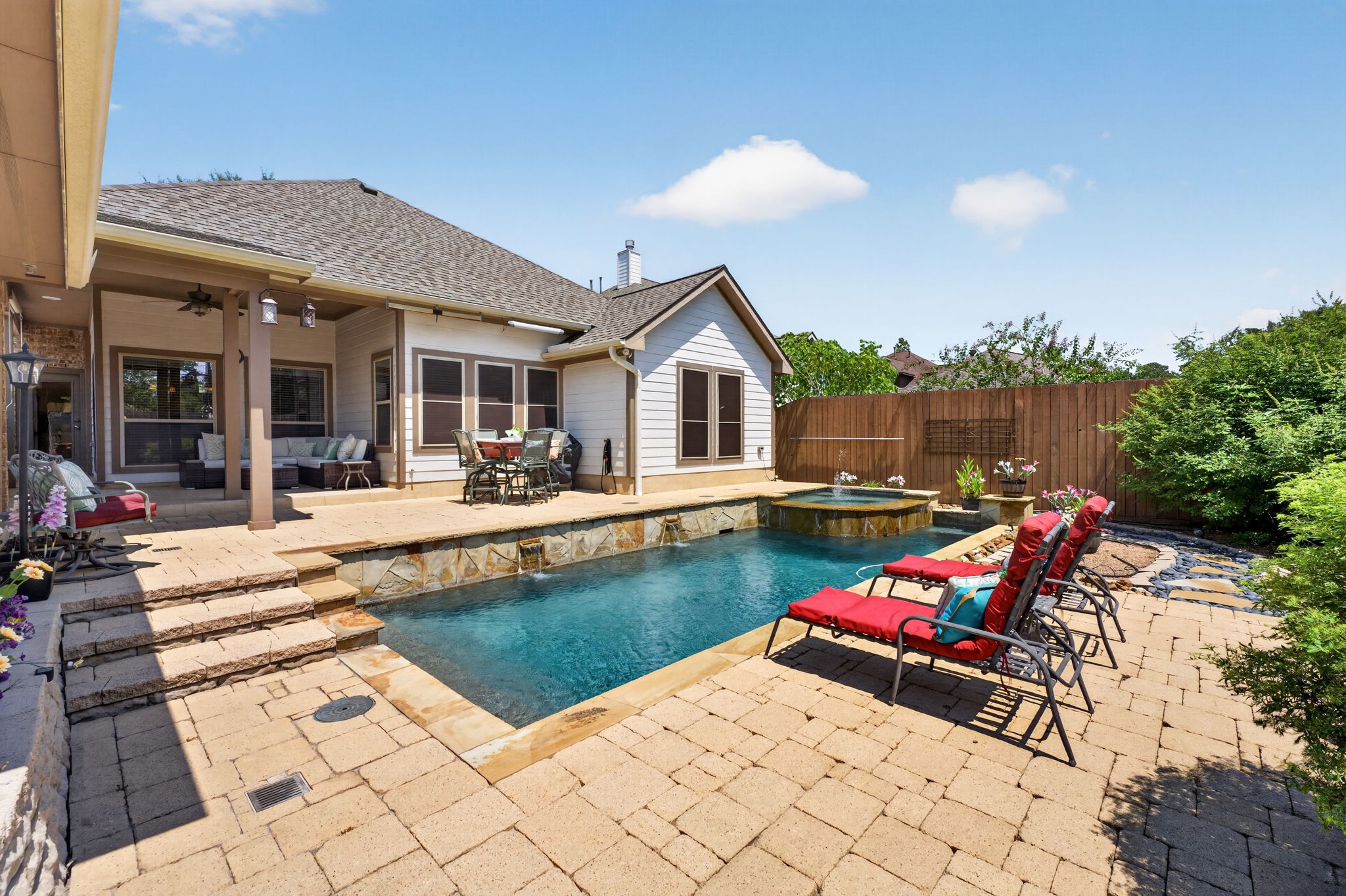 514 Oak Ridge Grove Circle Spring, TX 77386 - Photo 32 of 35 Inviting pool and spa with attractive paver decking and multiple areas for relaxing in the sun or shade. The pool heater was replaced in 2026.