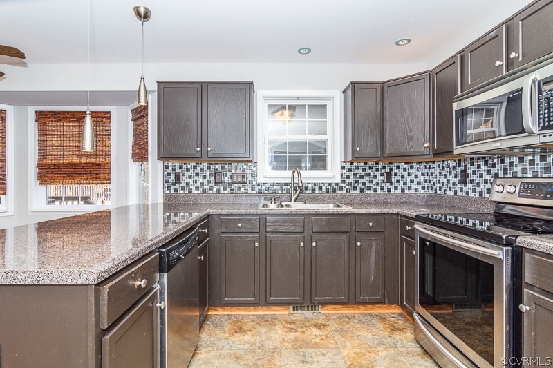 20006 Ivan Road Petersburg, VA 23803 - Photo 5 of 38 a kitchen with a sink stove top oven and cabinets
