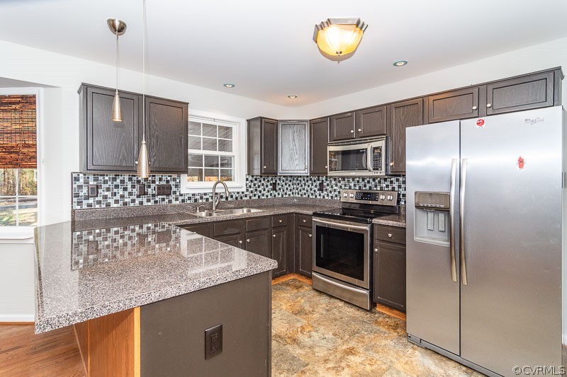 20006 Ivan Road Petersburg, VA 23803 - Photo 6 of 38 a kitchen with granite countertop a sink a counter top space stainless steel appliances and cabinets