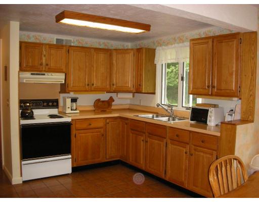236 Worcester Road Princeton, MA 01541 - Photo 11 of 14 a kitchen with stainless steel appliances granite countertop a stove a sink and a microwave