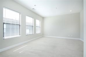 611 Sydnor Street Houston, TX 77020 - Photo 18 of 26 an empty room with a window