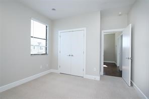 611 Sydnor Street Houston, TX 77020 - Photo 24 of 26 an empty room with windows and closet