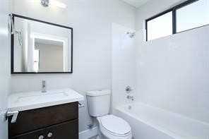 611 Sydnor Street Houston, TX 77020 - Photo 25 of 26 a bathroom with a sink a toilet and shower