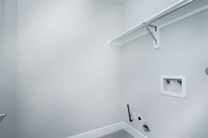 611 Sydnor Street Houston, TX 77020 - Photo 26 of 26 a bathroom with a shower and a window