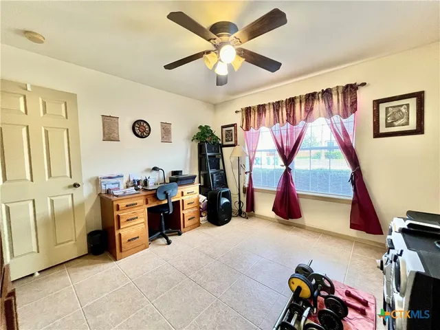 a bedroom with furniture and a window