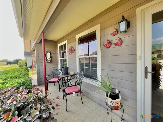 a backyard of a house with seating space