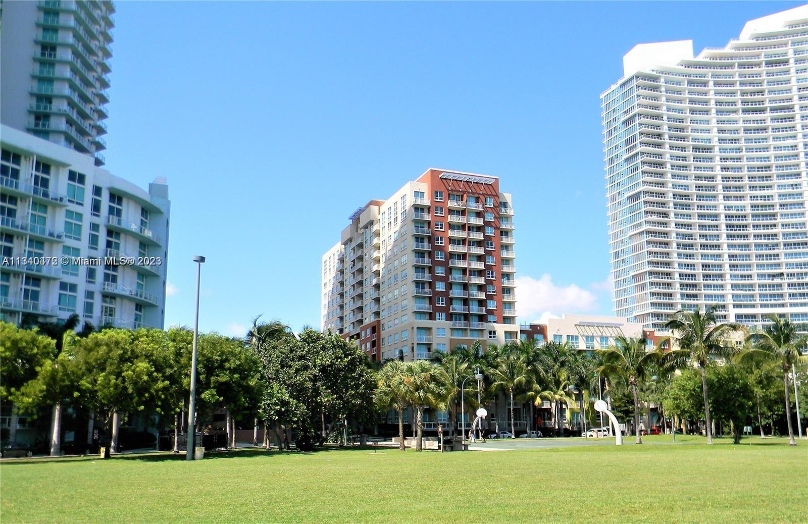 2001 Biscayne Boulevard, Unit 2505 Miami, FL 33137 - Photo 18 of 18 a tall building with a yard in front of it