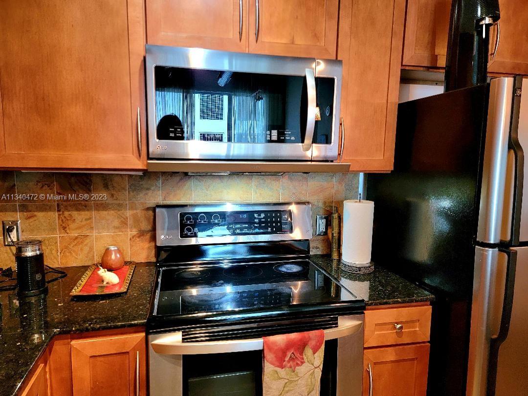 2001 Biscayne Boulevard, Unit 2505 Miami, FL 33137 - Photo 6 of 18 a stove top oven sitting inside of a kitchen
