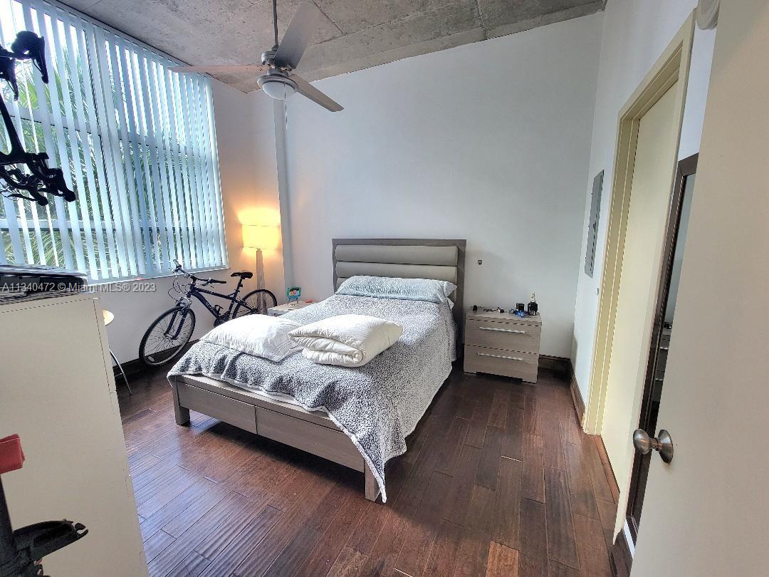 2001 Biscayne Boulevard, Unit 2505 Miami, FL 33137 - Photo 7 of 18 a bedroom with a bed and a window
