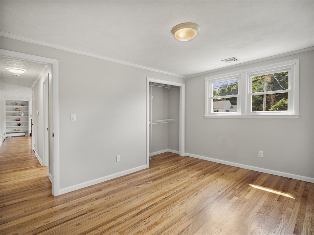 85 Dalton Road Chelmsford, MA 01824 - Photo 16 of 39 a view of empty room with wooden floor and fan