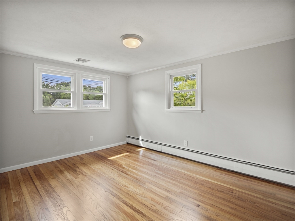 85 Dalton Road Chelmsford, MA 01824 - Photo 18 of 39 a view of room with window and wooden floor
