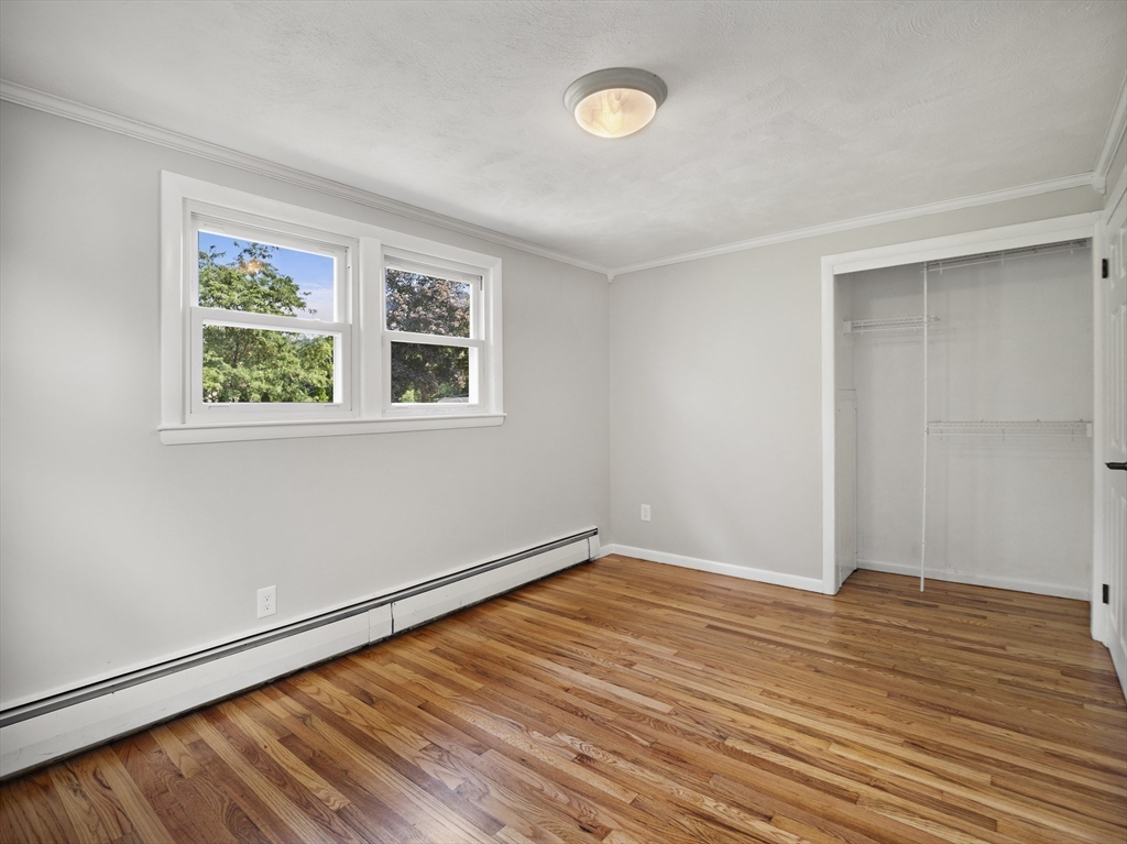 85 Dalton Road Chelmsford, MA 01824 - Photo 19 of 39 an empty room with wooden floor and windows