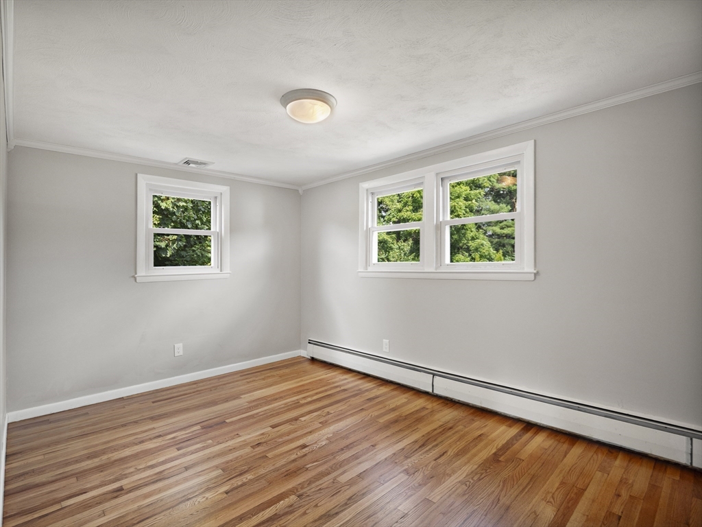 85 Dalton Road Chelmsford, MA 01824 - Photo 21 of 39 a view of a room with wooden floor and window
