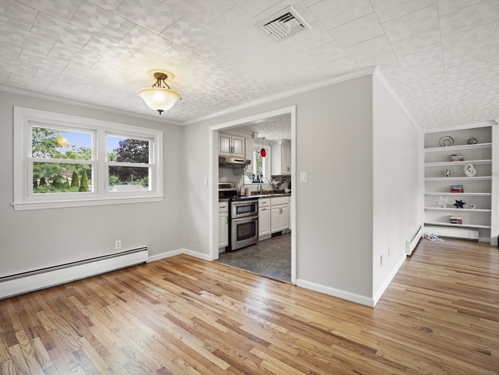 85 Dalton Road Chelmsford, MA 01824 - Photo 5 of 39 a view of a kitchen with wooden floor and a window