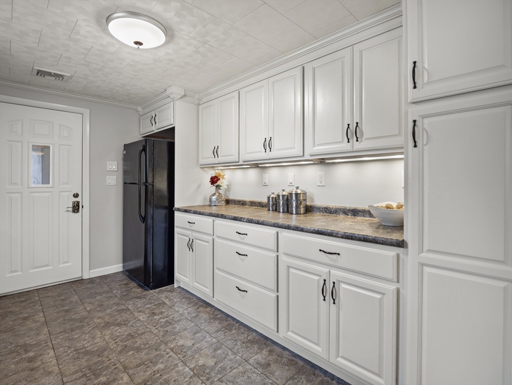 85 Dalton Road Chelmsford, MA 01824 - Photo 9 of 39 a kitchen with granite countertop white cabinets and refrigerator
