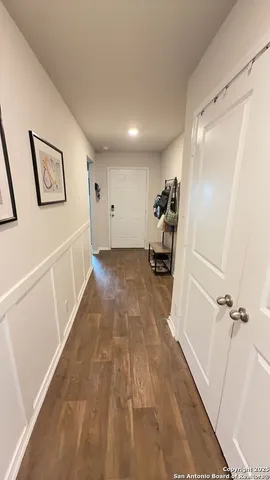 a view of a hallway with stairs