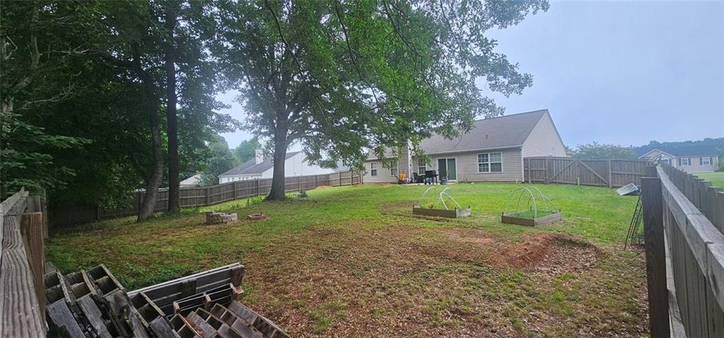 501 Grandview Circle Powder Springs, GA 30127 - Photo 6 of 6 a view of a house with backyard and trees