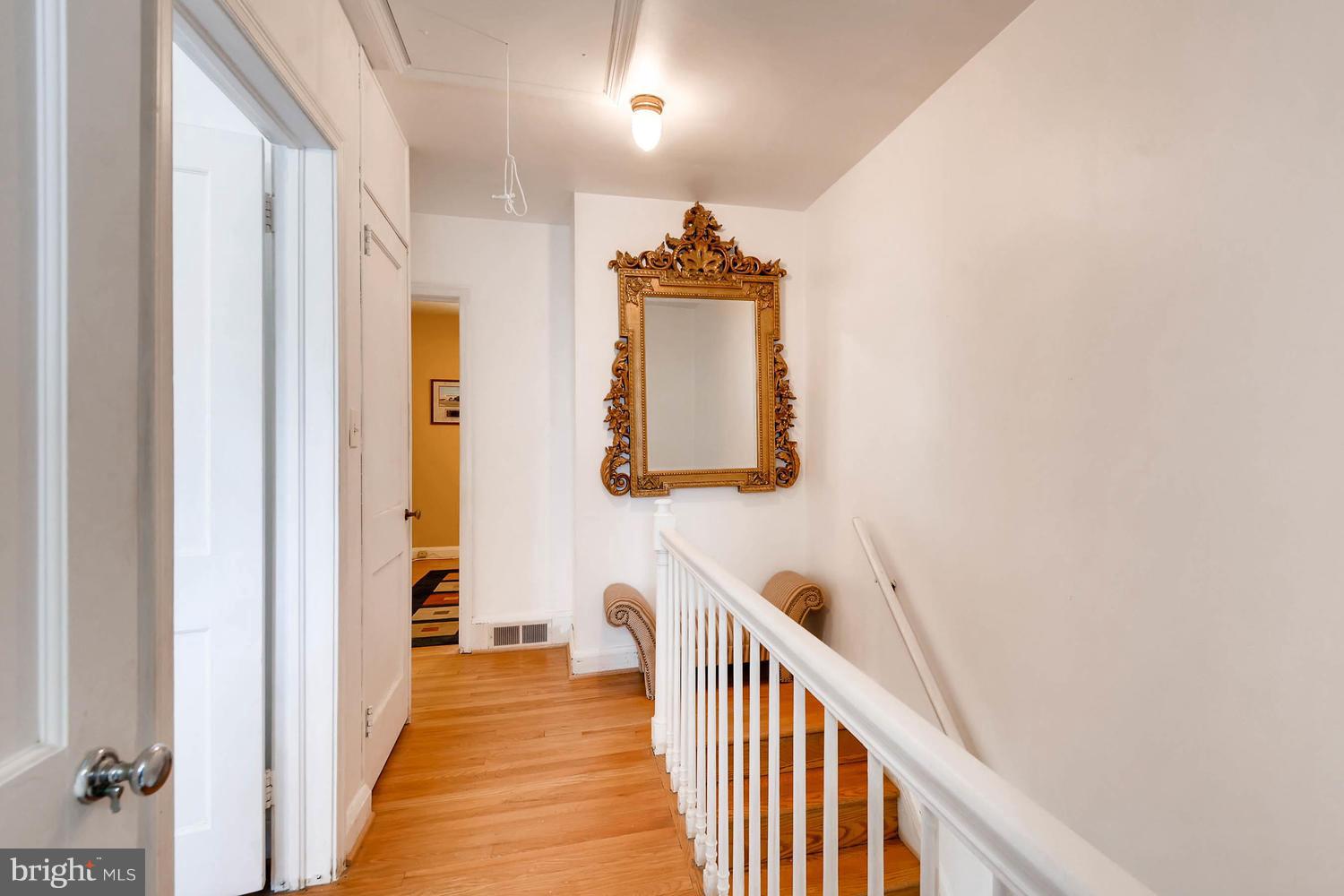 8417 Greenway Road Towson, MD 21286 - Photo 23 of 30 HALLWAY WITH ATTIC PULL-DOWN STAIRS