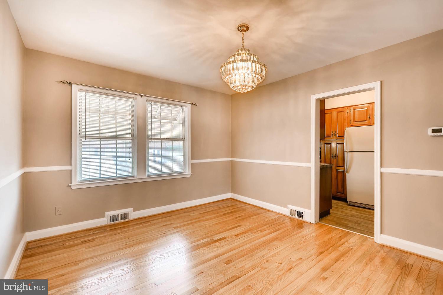 8417 Greenway Road Towson, MD 21286 - Photo 10 of 30 DINING ROOM WITH CHANDELIER AND CHAIR RAIL