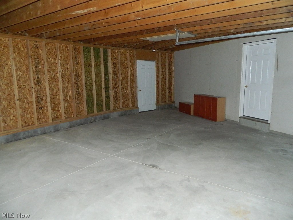 8675 Wilson Mills Road Chesterland, OH 44026 - Photo 22 of 23 Room in the Garage for a Workbench ... Access Door to Back of House.