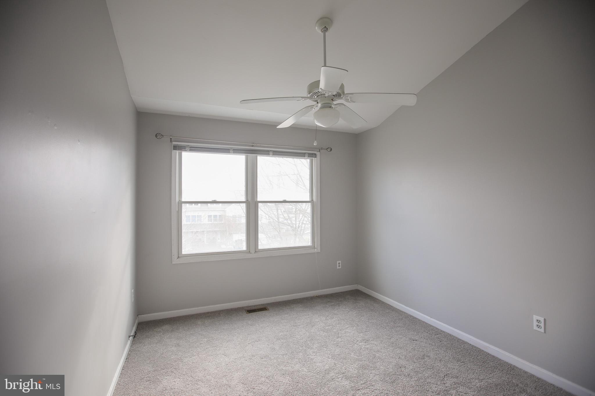 206 Blenny Lane Chester, MD 21619 - Photo 17 of 30 an empty room with a window and a fan