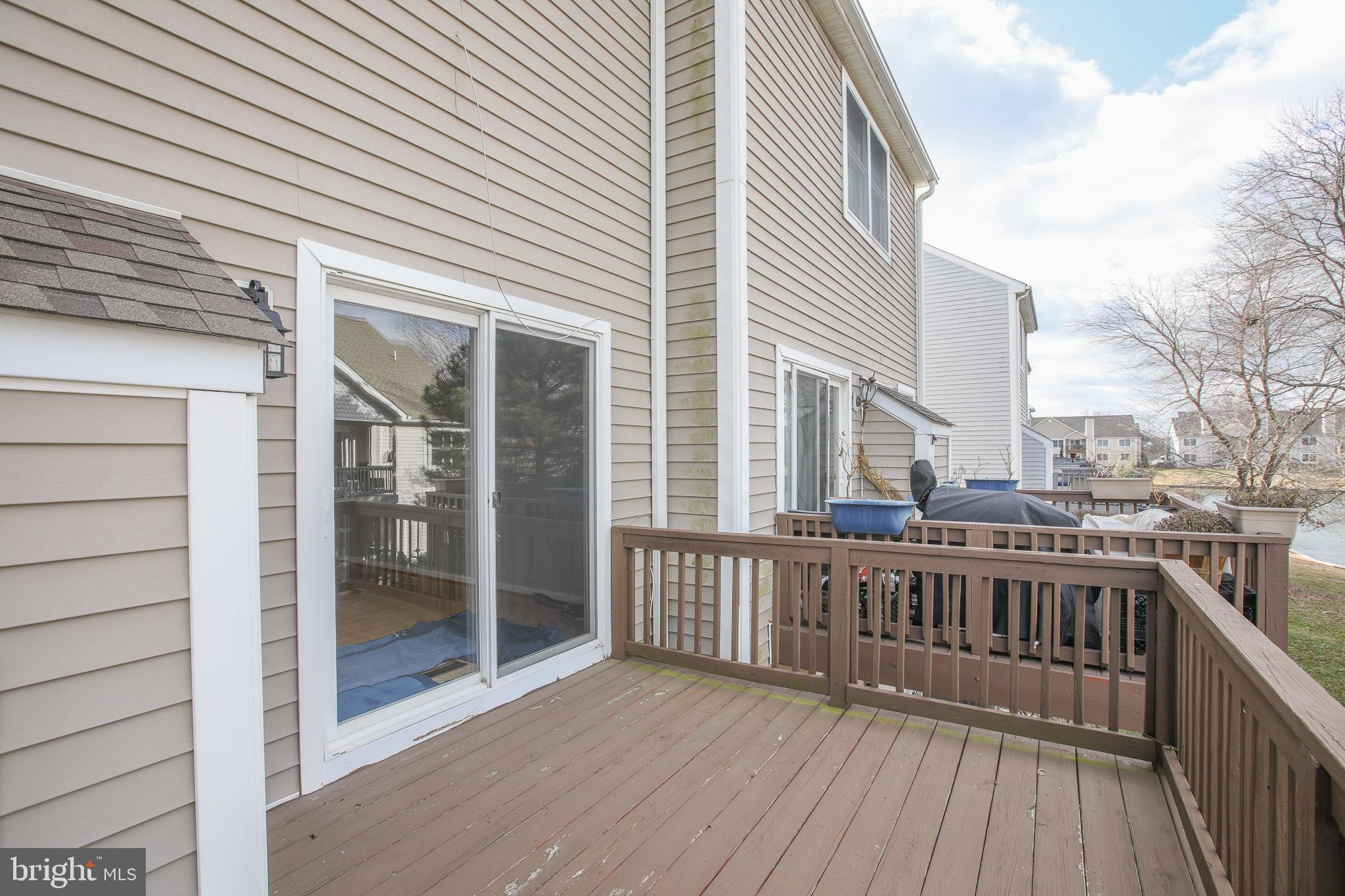 206 Blenny Lane Chester, MD 21619 - Photo 26 of 30 a view of a roof deck with wooden floor and fence