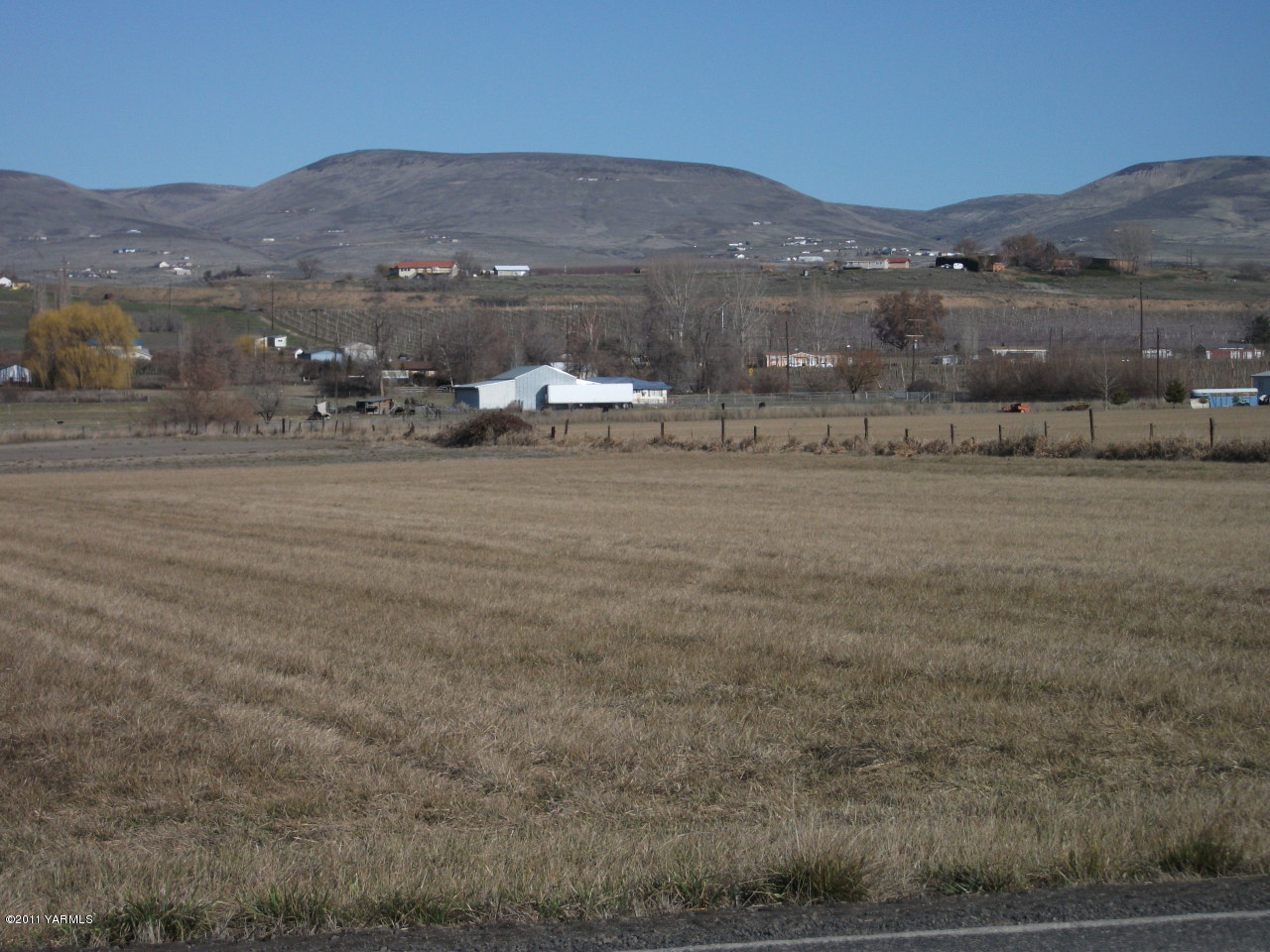 2350 Duffield Road Moxee, WA 98936 - Photo 19 of 21 a view of a town with mountains in the background