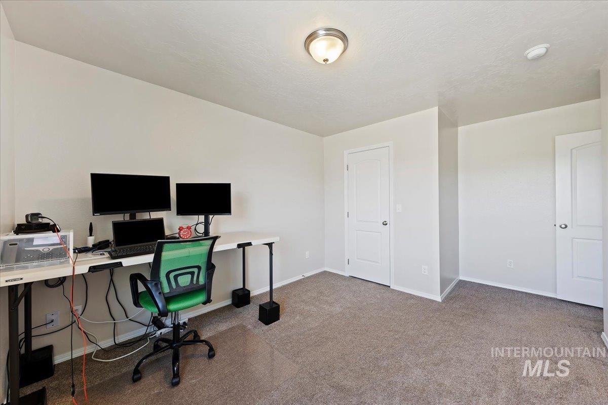 1555 Condor Drive Middleton, ID 83644 - Photo 40 of 50 Carpeted room featuring light-colored walls and white trim