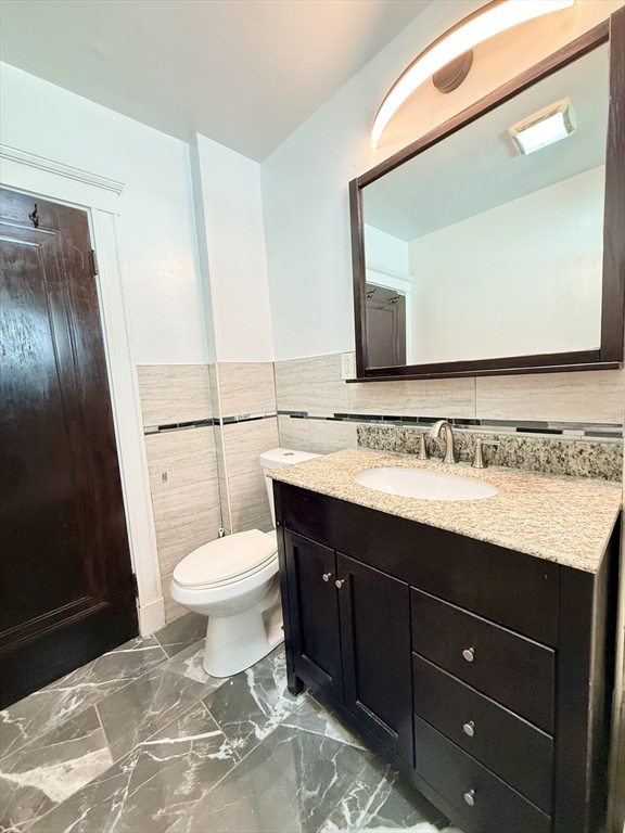 48 Rosewood Street, Unit 2 Boston, MA 02126 - Photo 15 of 26 a bathroom with a sink and a mirror