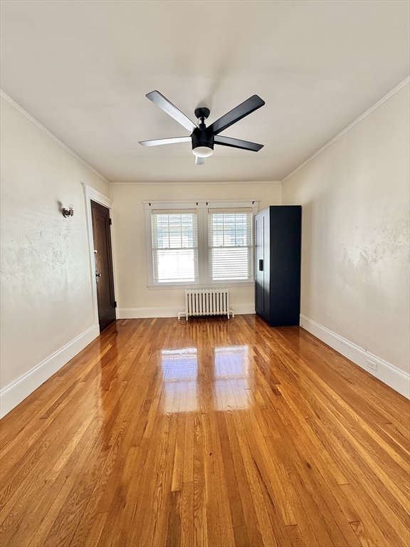 48 Rosewood Street, Unit 2 Boston, MA 02126 - Photo 18 of 26 a view of empty room with wooden floor and fan