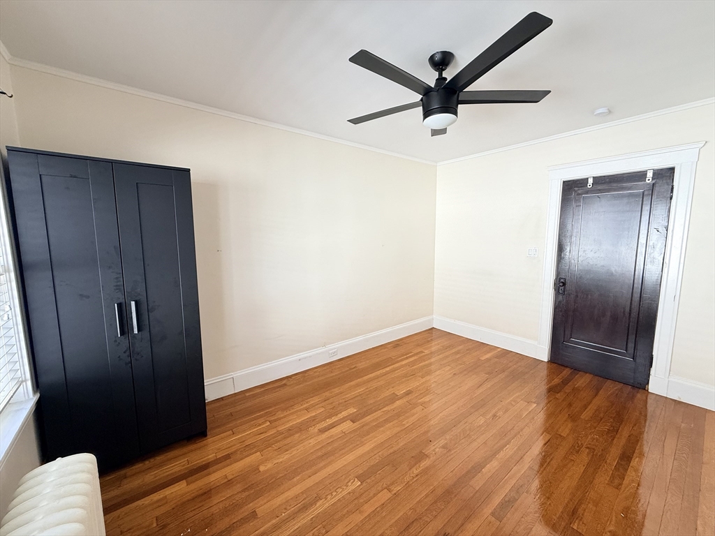48 Rosewood Street, Unit 2 Boston, MA 02126 - Photo 19 of 26 a view of empty room with wooden floor
