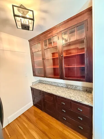 a view of staircase with wooden floor