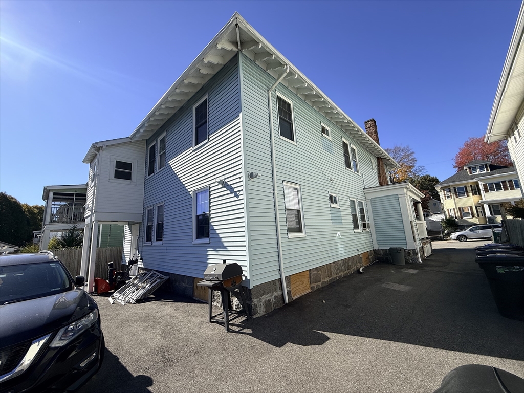48 Rosewood Street, Unit 2 Boston, MA 02126 - Photo 25 of 26 a front view of a house with parking space