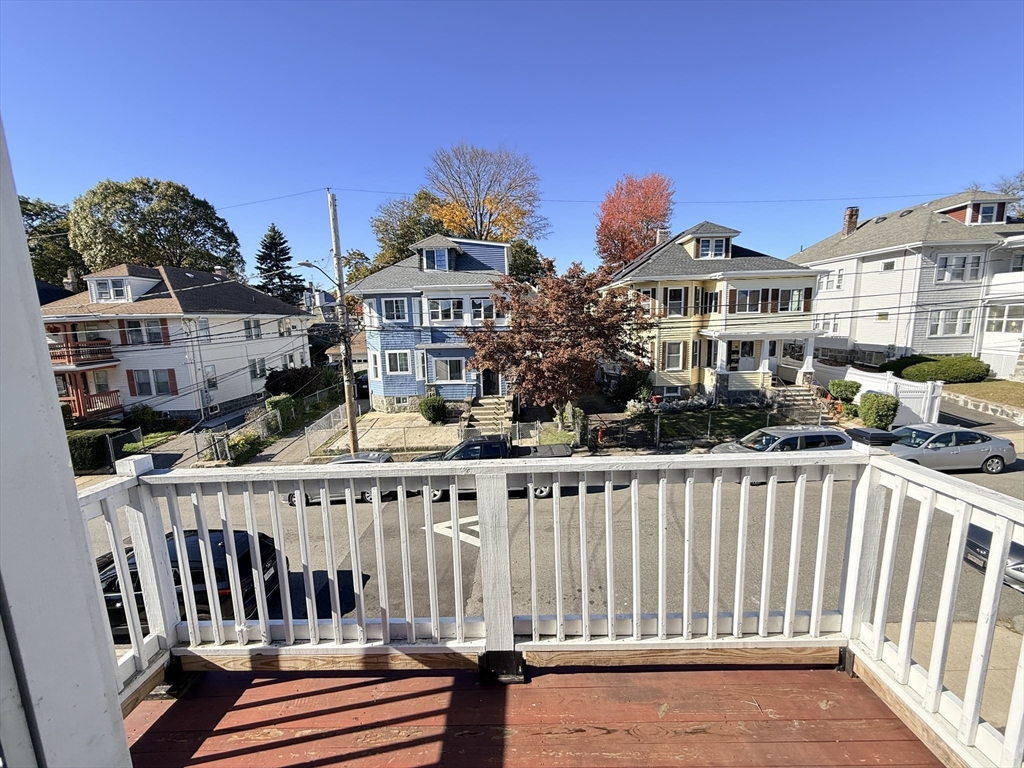 48 Rosewood Street, Unit 2 Boston, MA 02126 - Photo 8 of 26 a view of a building with a bench