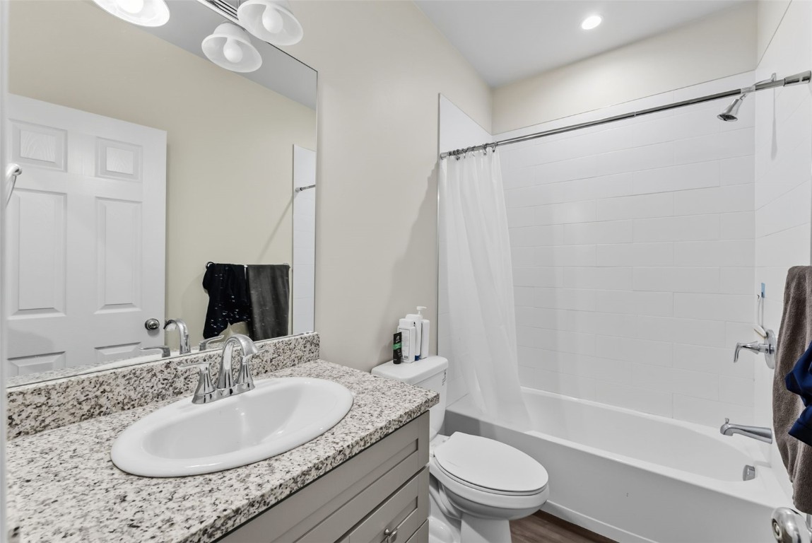 83 Ermine Road, Unit 3A Dillon, CO 80435 - Photo 16 of 33 a bathroom with a granite countertop sink toilet and shower