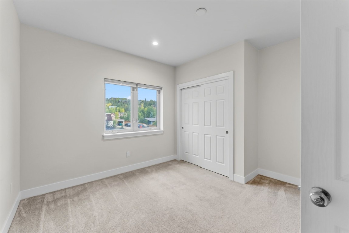 83 Ermine Road, Unit 3A Dillon, CO 80435 - Photo 18 of 33 an empty room with windows