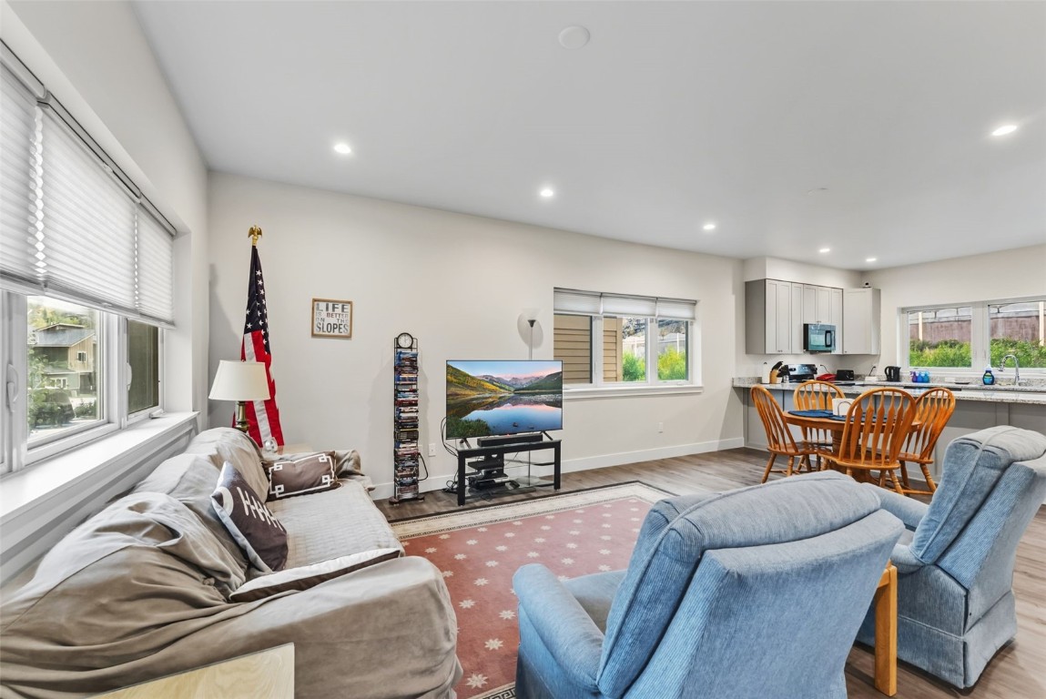 83 Ermine Road, Unit 3A Dillon, CO 80435 - Photo 2 of 33 a living room with furniture and a wooden floor