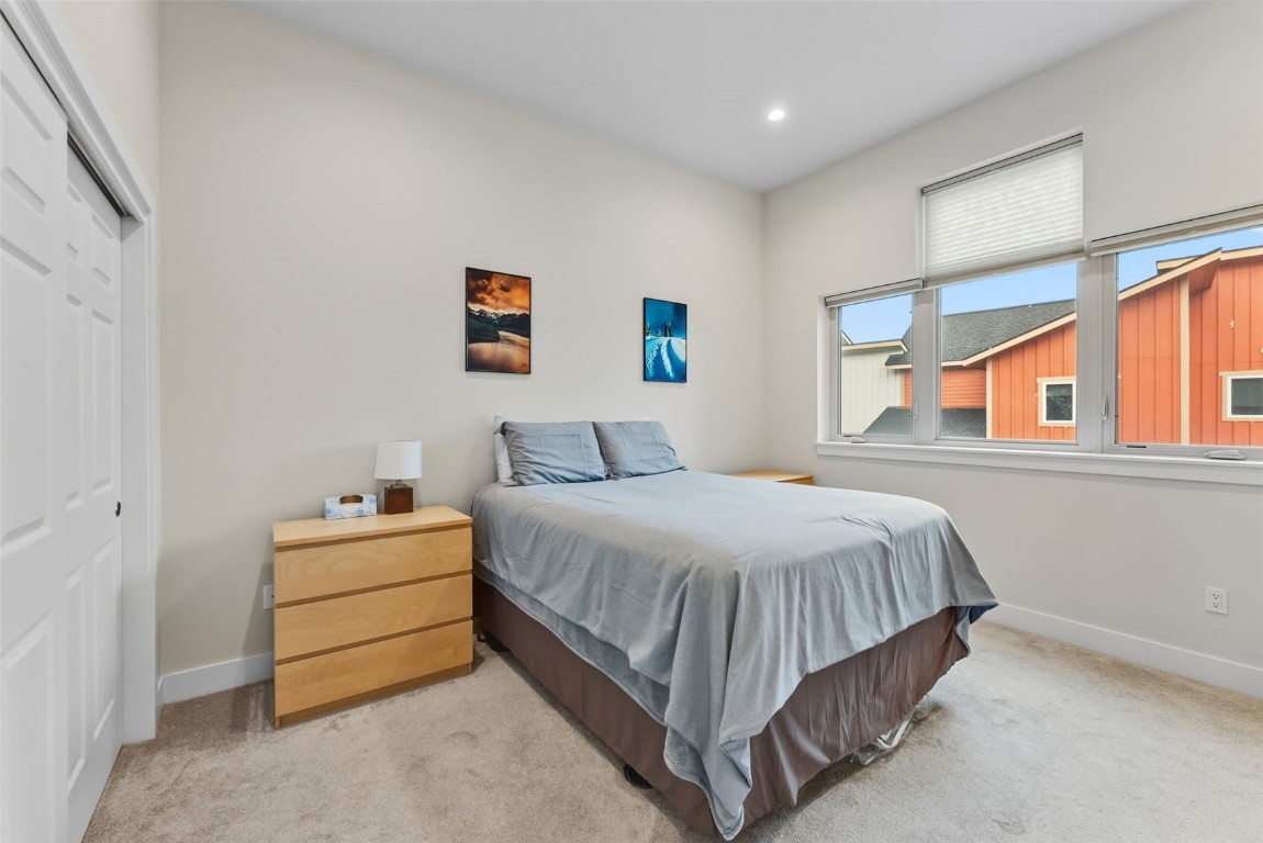 83 Ermine Road, Unit 3A Dillon, CO 80435 - Photo 21 of 33 a bedroom with a bed and a window