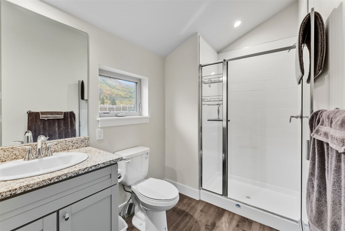 83 Ermine Road, Unit 3A Dillon, CO 80435 - Photo 22 of 33 a bathroom with a granite countertop sink toilet and shower