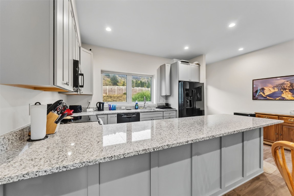 83 Ermine Road, Unit 3A Dillon, CO 80435 - Photo 7 of 33 a kitchen with sink refrigerator and window