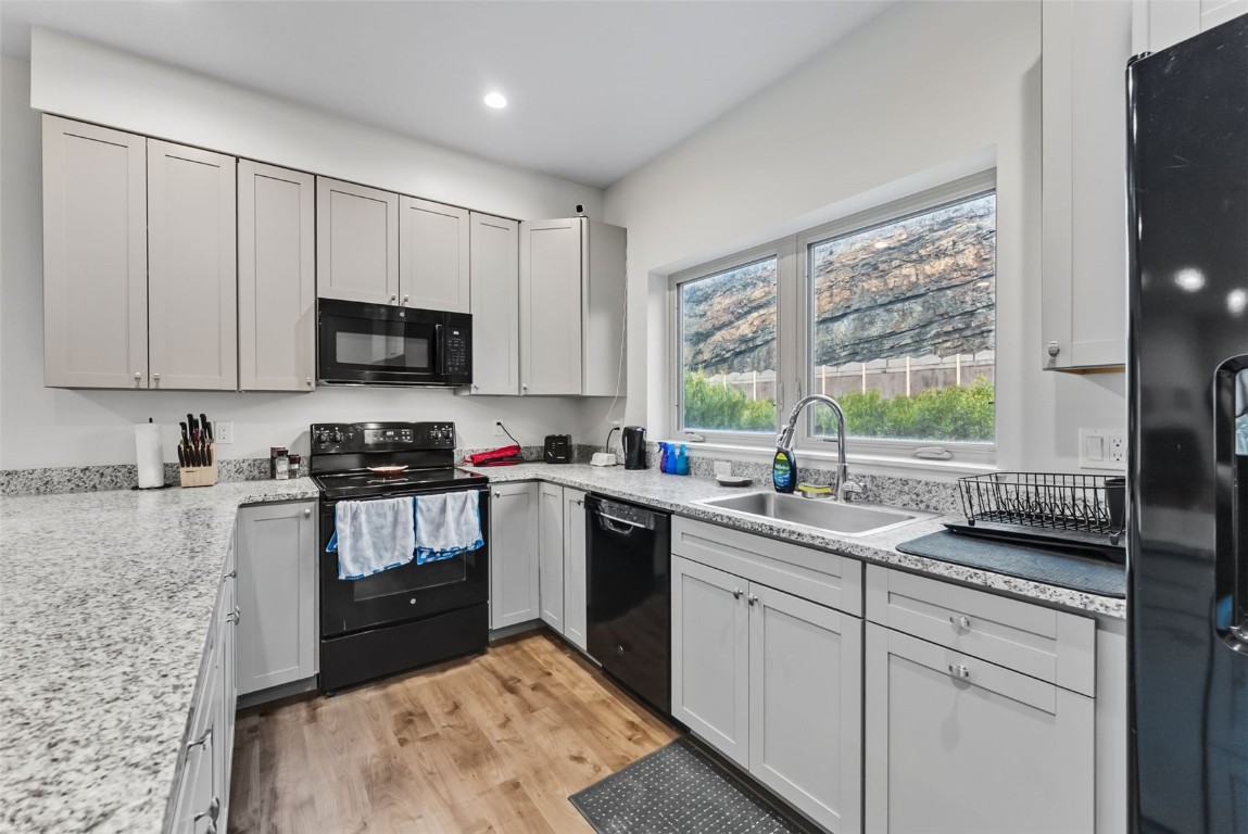 83 Ermine Road, Unit 3A Dillon, CO 80435 - Photo 9 of 33 a kitchen with a sink stove top oven and microwave
