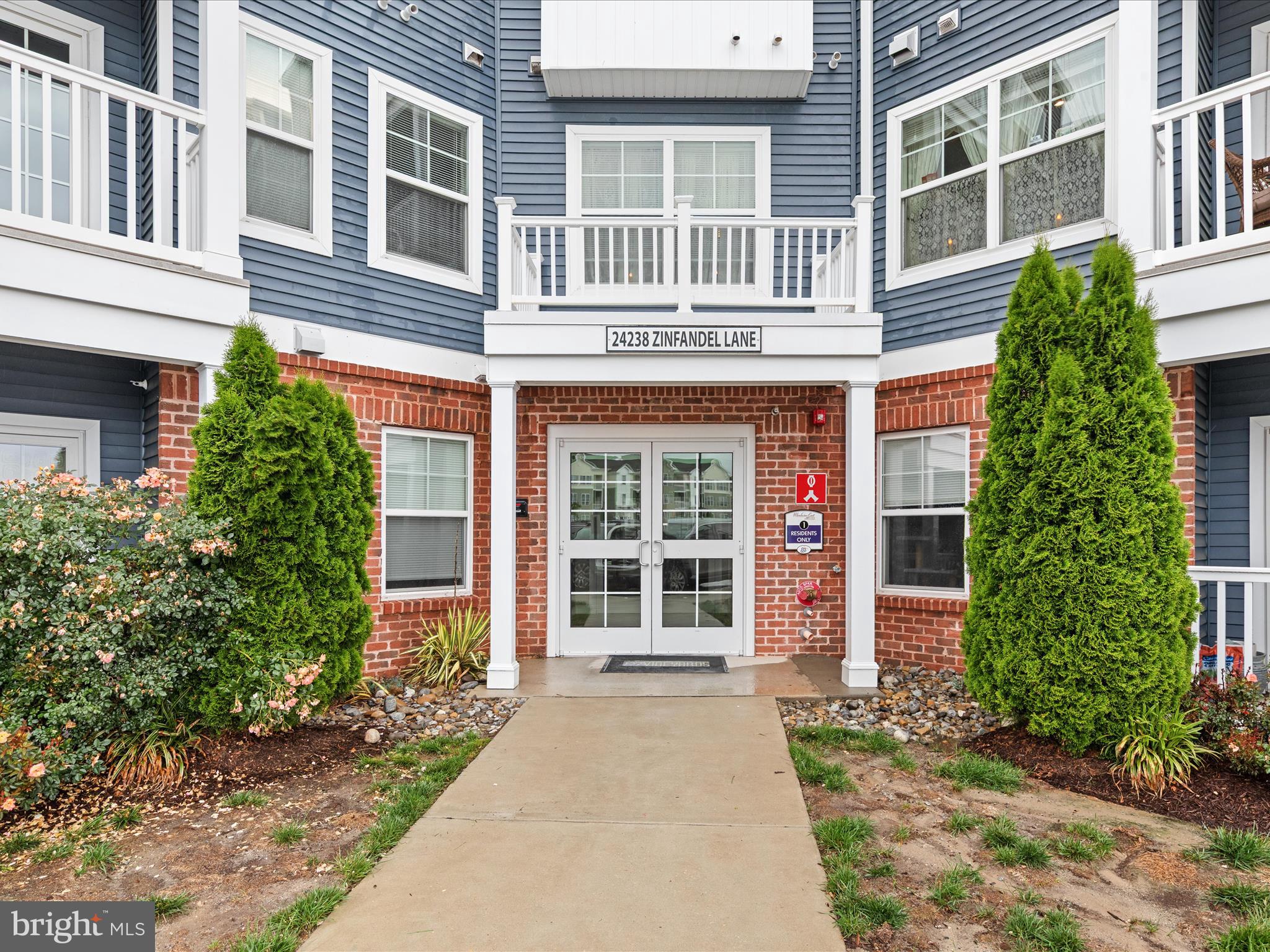 24258 Zinfandel Lane, Unit R303 Lewes, DE 19958 - Photo 2 of 82 front view of a brick house with a large windows