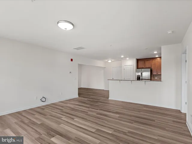 a bathroom with a sink a toilet and a large mirror