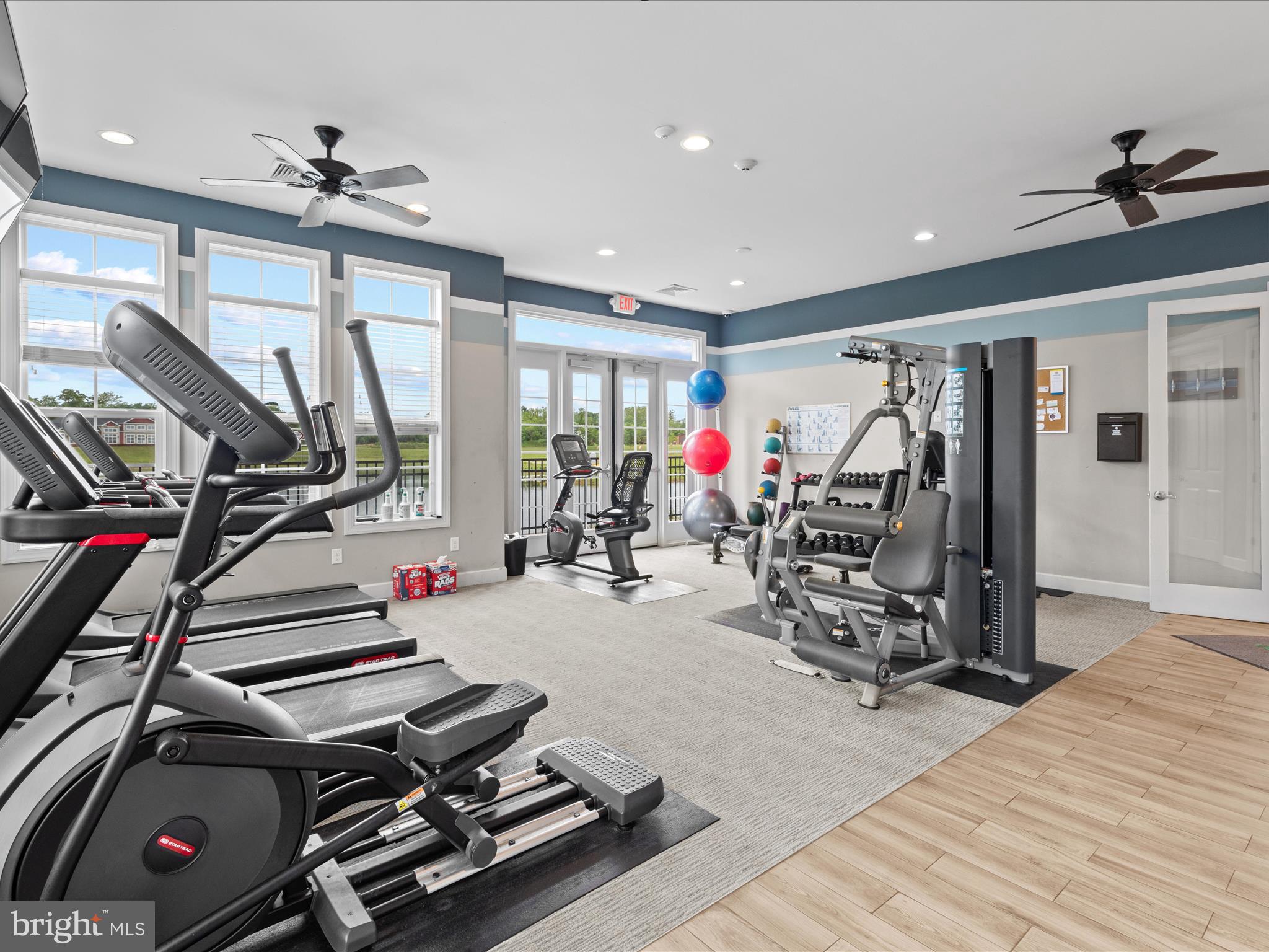 24258 Zinfandel Lane, Unit R303 Lewes, DE 19958 - Photo 50 of 82 a room with gym equipment and a large mirror