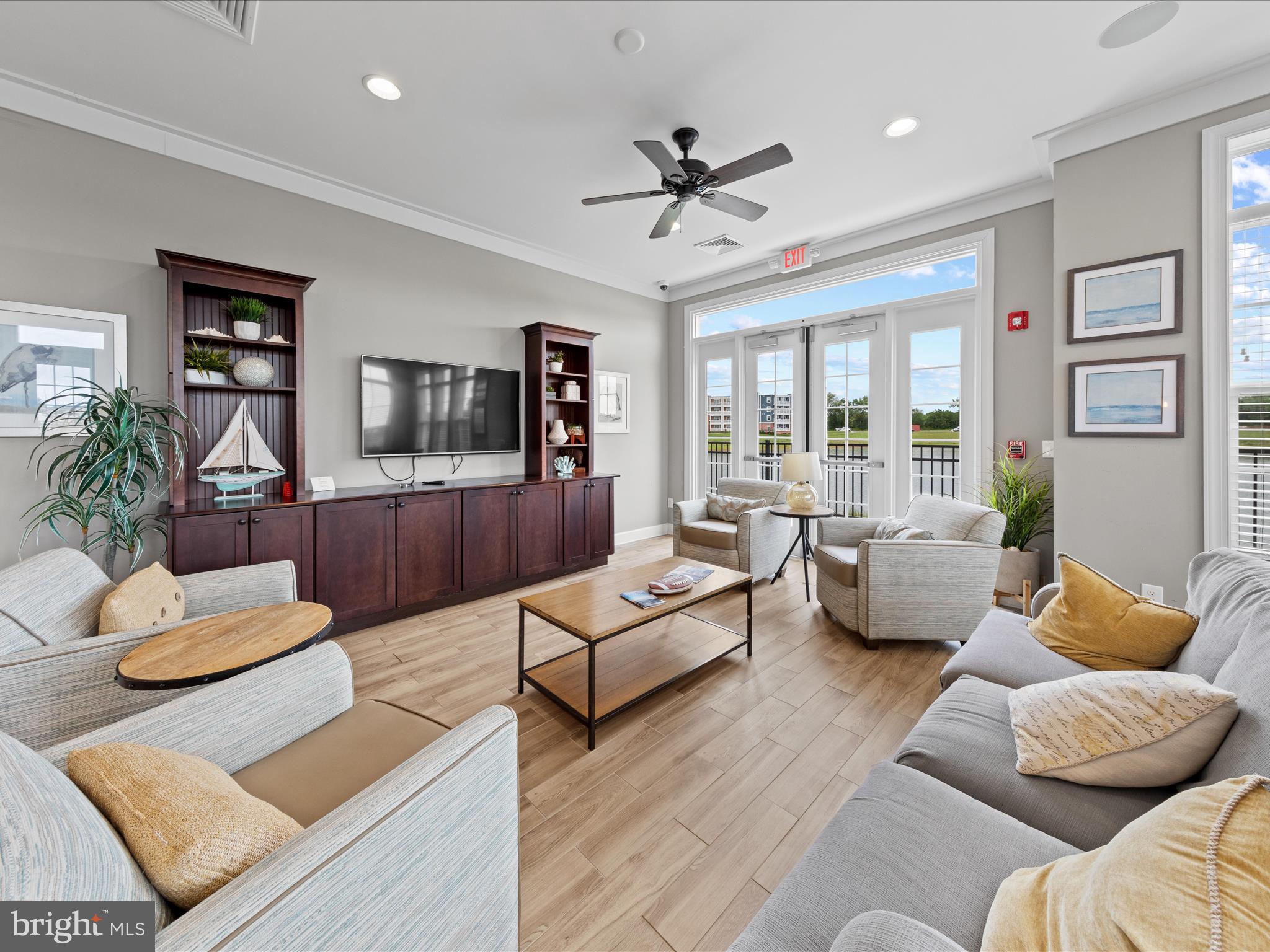 24258 Zinfandel Lane, Unit R303 Lewes, DE 19958 - Photo 54 of 82 a living room with furniture and a flat screen tv