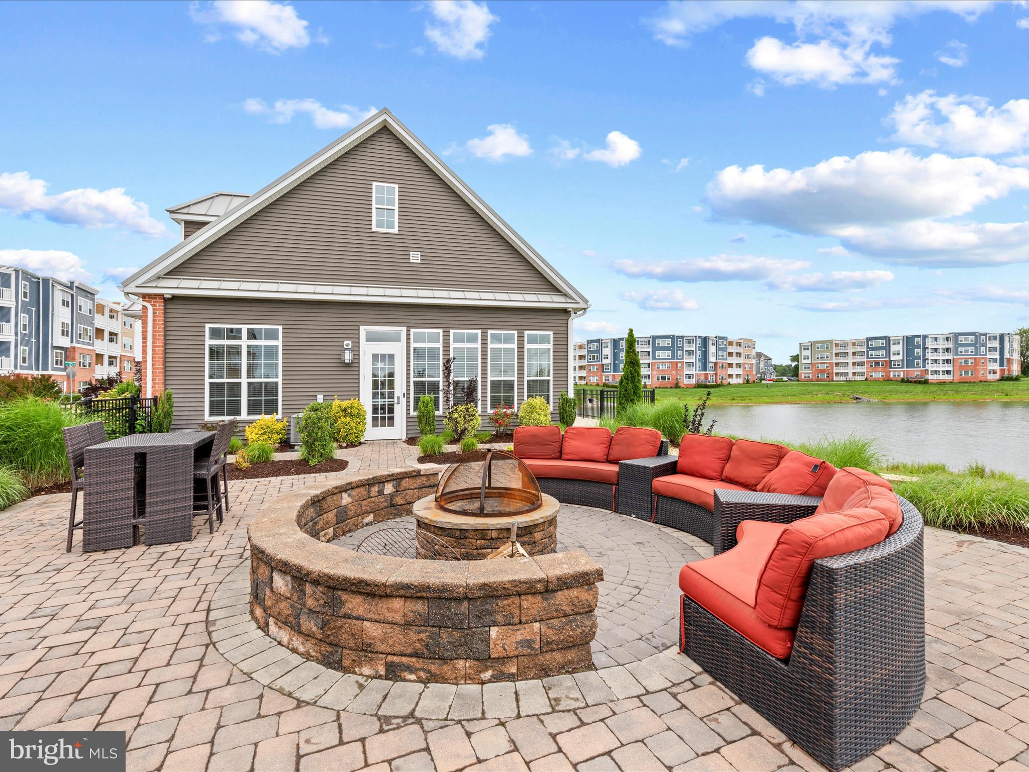 24258 Zinfandel Lane, Unit R303 Lewes, DE 19958 - Photo 63 of 82 a outdoor space with patio the couches and pool