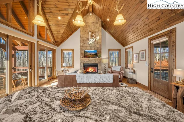 a large kitchen with a table and chairs